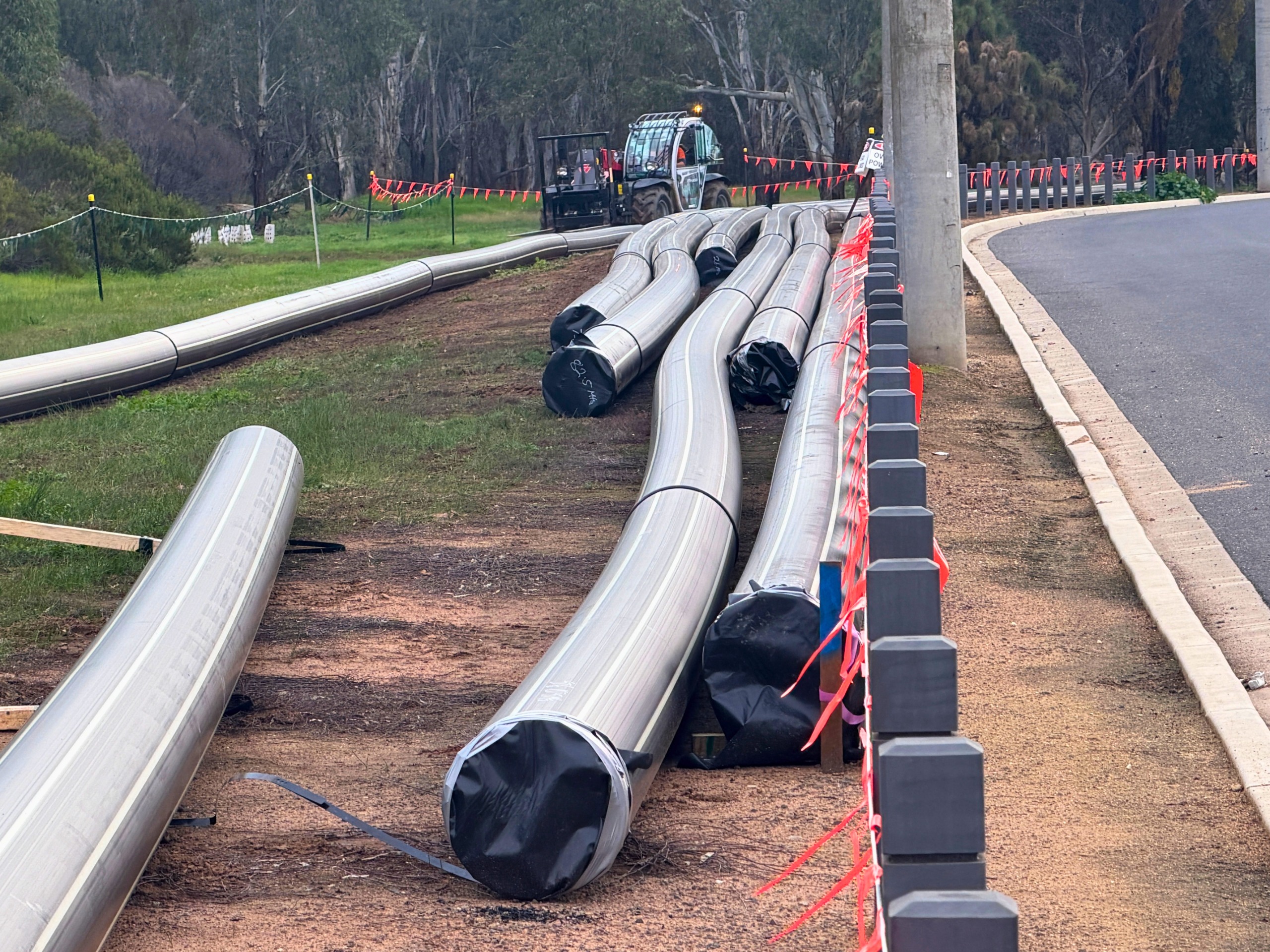Sewer main pipes which will be used in the construction of the pipeline, including a section along Broken River Drive.